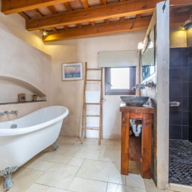 Bathroom with bathtub and shower at Riad Casa Luna in Tarifa