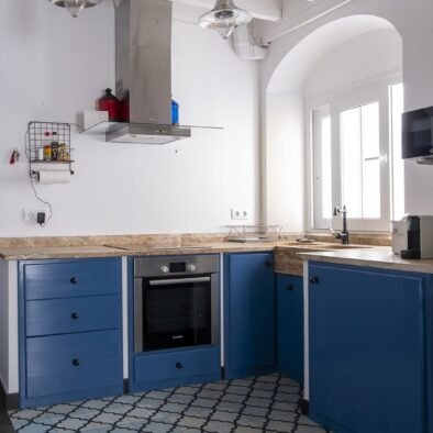 Blue kitchen with dining area at Rooftop Penthouse in Tarifa